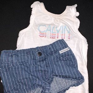 Two piece baby outfit cute summer shirt with some shorts brand is Calvin Klein.